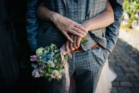 wedded couple standing in the gardenの写真素材