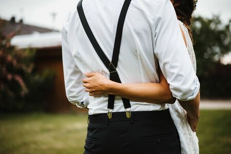 a wedded couple standing in a big gardenの写真素材