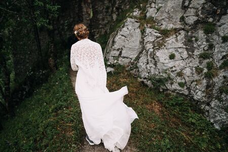 a bride walking in the forestの写真素材