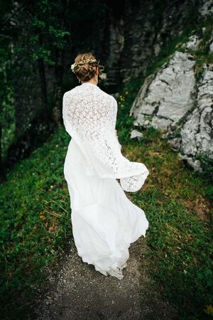 a bride walking in the forestの写真素材