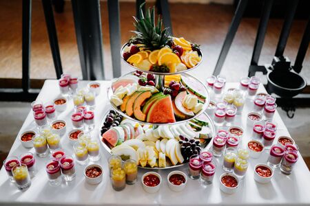 dessert table at a party with fruitsの写真素材