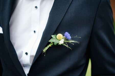 a groom's suit with flowersの写真素材