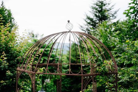 a bird cage in the gardenの写真素材