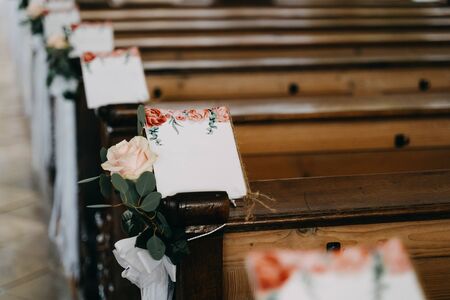 wooden church chairs at a weddingの写真素材