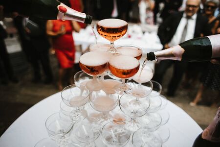 champagne glasses pyramid in a partyの写真素材