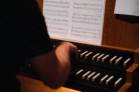 a man playing an organ in a church