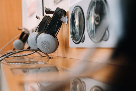 vintage headphones on a rustic or bare wooden table wall