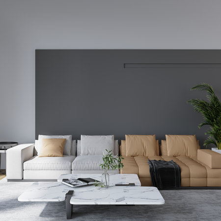 Interior of modern living room with gray walls, concrete floor, comfortable brown sofa standing near coffee table and white coffee table. 3d renderingの写真素材