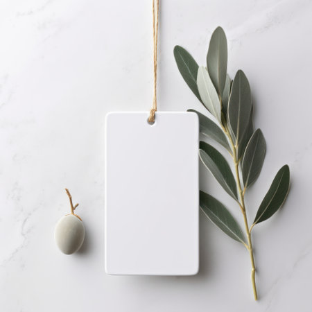 Blank price tag with eucalyptus branchle backgroundの素材