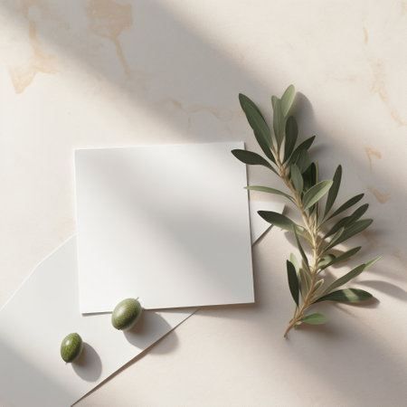 Olive branch with leaves and blank cardle background. Flat lay, top viewの素材