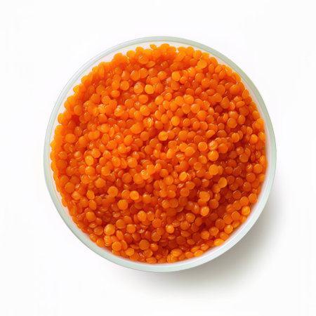 Red caviar in bowl isolated on white background. Top view.の素材