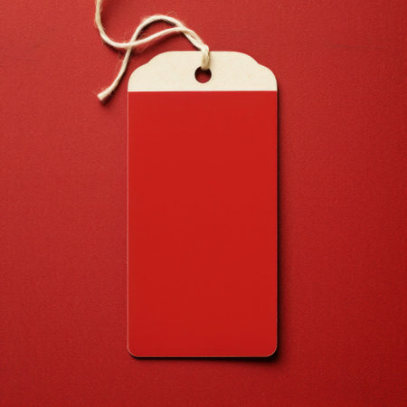Blank red price tag with string on red background, copy spaceの素材