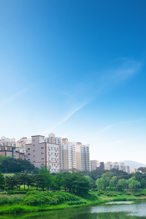 Apartment house and lake park.の写真素材