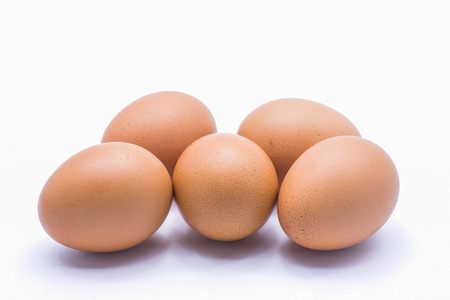 Chicken eggs on a white backgroundの写真素材