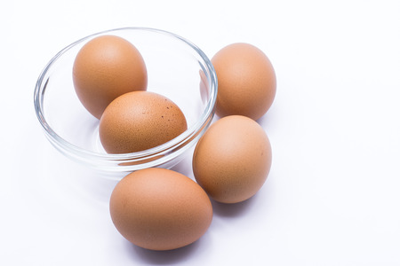 Chicken eggs on a white backgroundの写真素材