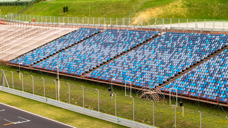 Budapest, Hungary - AUG 15, 2017: Blue seats of the grandstand next to the finish line of Hungaroring. It's a motorsport race track in Hungary where the Formula One Hungarian Grand Prix is ??held.のeditorial素材