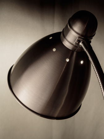 A retro styled lamp facing against the curtain in the living room.の写真素材