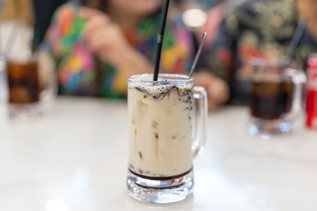 Unique Malaysian beverages such as coffee with milk (kopi) at a local shop in a shopping mall in...