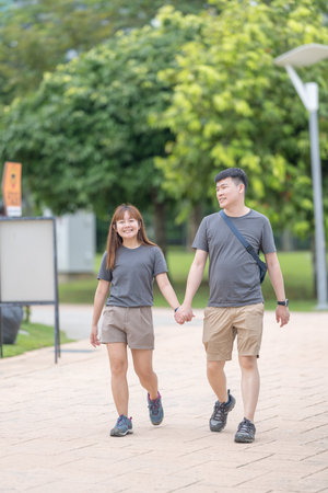 Chinese Malaysian couple in their 30s shopping and chatting at a dried meat shop in Kuala Lumpur, Malaysia.の写真素材