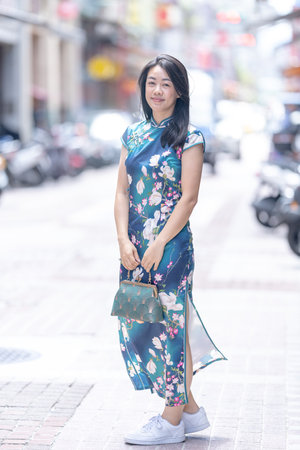 Woman in traditional Chinese clothing standing on Dihua Street Taipeiの写真素材