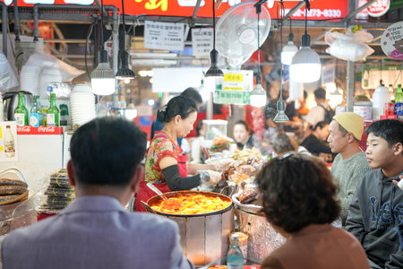 October 11, 2024. Food scene at market with many traditional food stalls in Changgyeonggung-ro, Jongno District, Seoul, South Korea.のeditorial素材