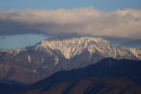 Mt. Senjogatake in the snow-covered sunset in Komagane City, Nagano Prefecture, Japan in winter.の写真素材