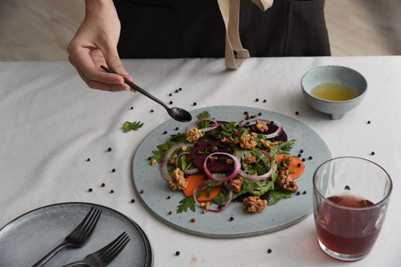 Salad with salad dressing for dinnerの写真素材