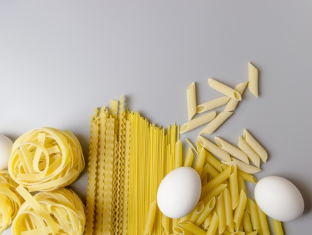 Italian pasta tagliatelle nest isolated on white backgroundの写真素材