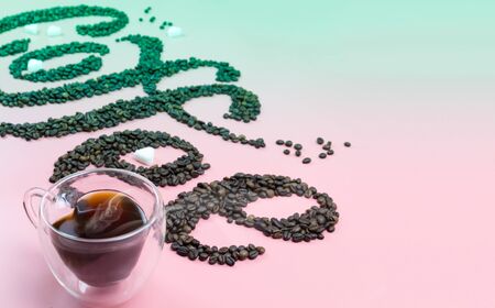 beans spelling the word coffee break and some beans on the bottom isolated on white background.の写真素材