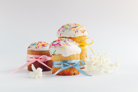 Traditional Easter cakes and Hyacinthus flowers on white background with copy space for text....