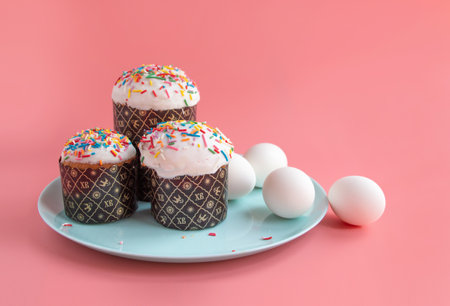 Traditional Easter cakes and Hyacinthus flowers on pink background with copy space for text....