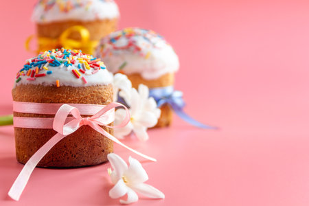 Traditional Easter cakes and Hyacinthus flowers on pink background with copy space for text. Traditional Kulich, Paska Easter Bread. Postcardの写真素材
