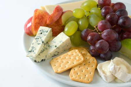 Assorted cheese served with fresh fruitの写真素材