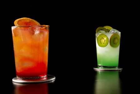 Two designer cocktails isolated on black backgroundの写真素材
