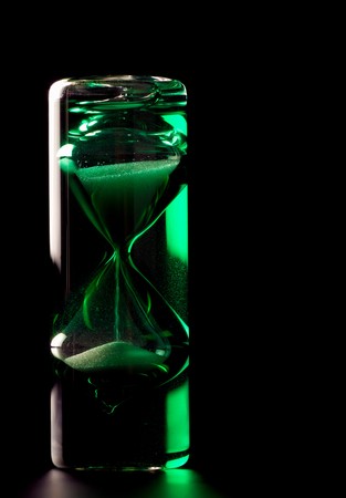 Handcrafted crystal hourglass counting time by pouring sand