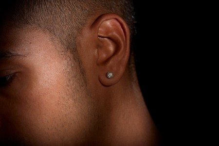 Close up of male jewelry, diamond ear ringの写真素材