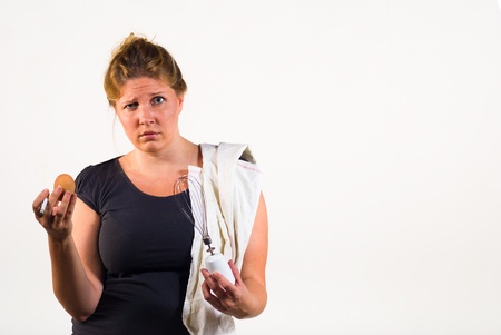 A messy woman totally overwhelmed when having to deal with an egg