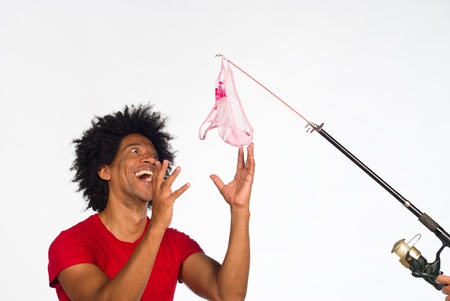 Guy about to bite onto the hook の写真素材