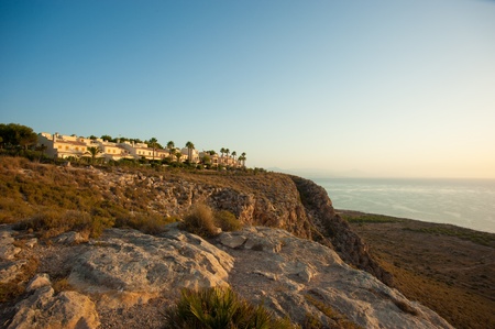 Houses located on top of a cliff overlooking the Mediterranean