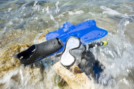 Snorkeling equipment ashore waiting in the tideの写真素材