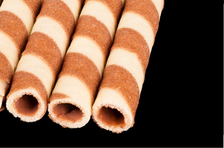 Rolled chocolate and vainilla wafers as used for decorating ice creamの写真素材