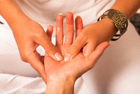 Closeup of a therapist massaging a handの写真素材