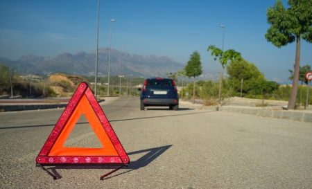 Orange triangle on the roadの写真素材