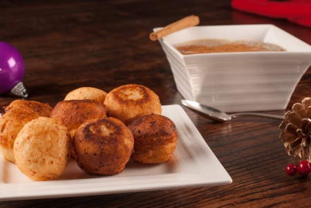 Traditional Colombian Christmas bunuelos  with natilla mousse in the bakcgroundの写真素材