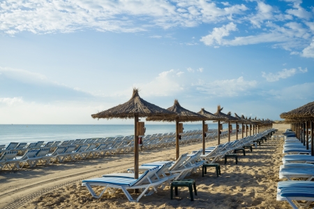 Early morning on a sunny Mediterranean resort beachの写真素材