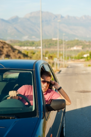 Aggressive guy yelling on the phone whiledrivingの写真素材