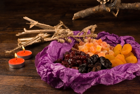 Assorted dried fruit in a Christmas settingの写真素材