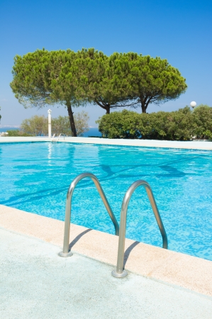 Pleasant swimming pool on a perfect sunny Mediterranean dayの写真素材