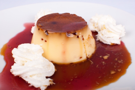 Spanish flan in a sweet bilberry sauceの写真素材