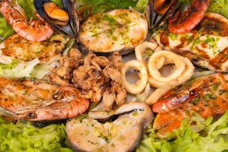 Assorted seafood grilled and served on saladの写真素材